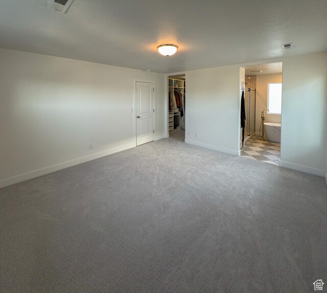 5051 W Bilston Ln S, Herriman, UT 84096 - interior space with a closet, a spacious closet, visible vents, light carpet, and baseboards