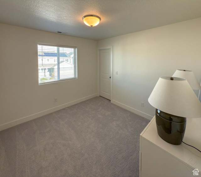 5051 W Bilston Ln S, Herriman, UT 84096 - carpeted spare room featuring a textured ceiling, baseboards, and visible vents
