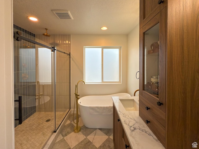 5051 W Bilston Ln S, Herriman, UT 84096 - full bath with visible vents, a freestanding tub, a shower stall, recessed lighting, and vanity