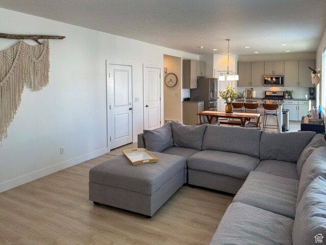 5051 W Bilston Ln S, Herriman, UT 84096 - living area with recessed lighting, light wood-style floors, and baseboards