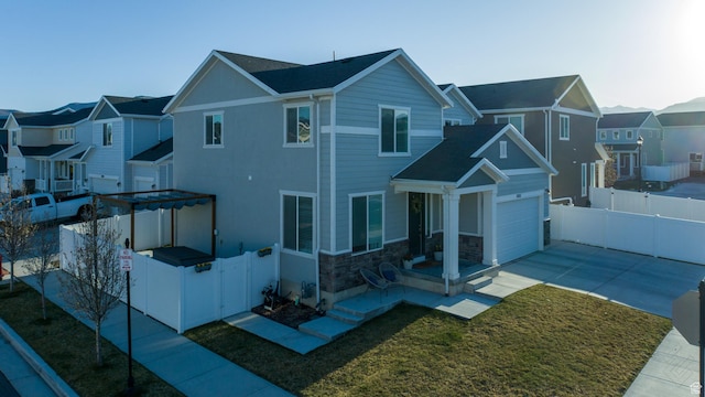 5051 W Bilston Ln S, Herriman, UT 84096 - view of front of home featuring a residential view, driveway, stone siding, and a gate