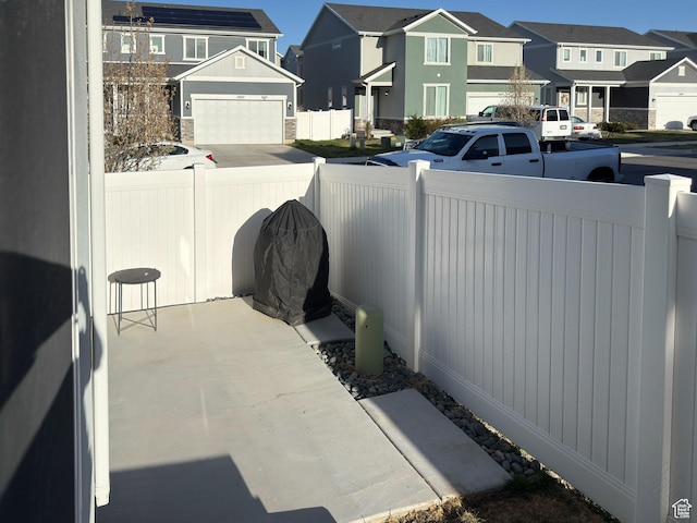 5051 W Bilston Ln S, Herriman, UT 84096 - view of patio with a residential view and fence private yard
