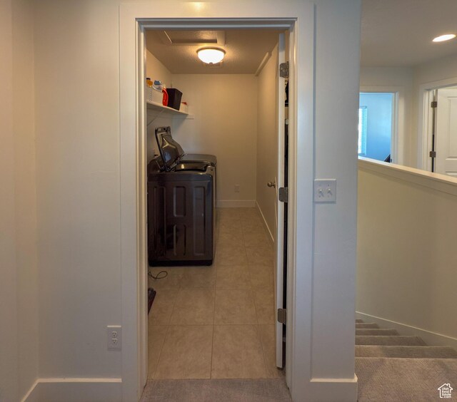 5051 W Bilston Ln S, Herriman, UT 84096 - corridor featuring light tile patterned floors, baseboards, and washer and dryer