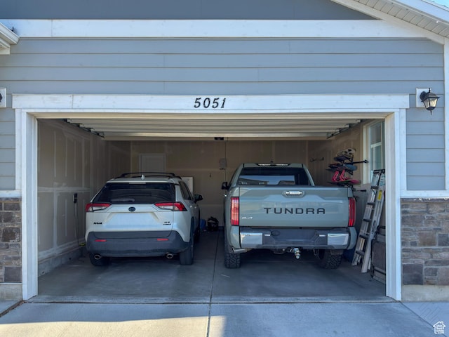5051 W Bilston Ln S, Herriman, UT 84096 - garage with concrete driveway