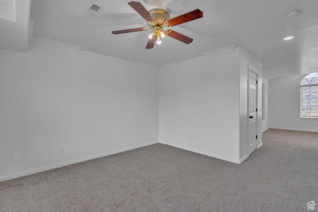 8079 S Juniper Ct, South Weber, UT 84405 - spare room with baseboards, ornamental molding, visible vents, ceiling fan, and carpet