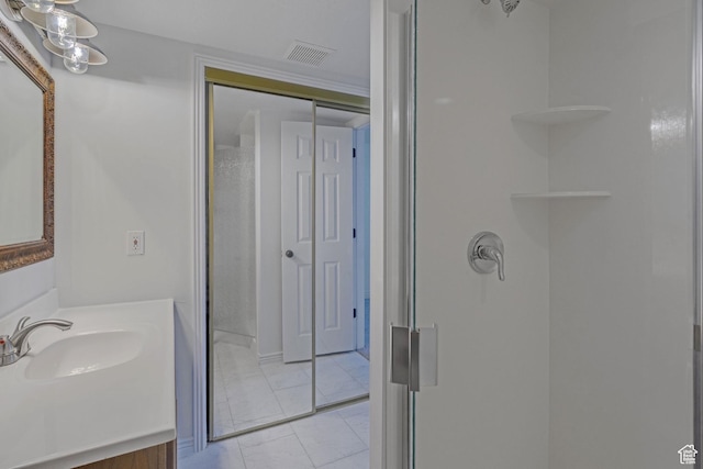 8079 S Juniper Ct, South Weber, UT 84405 - bathroom with a shower stall, tile patterned floors, vanity, and visible vents