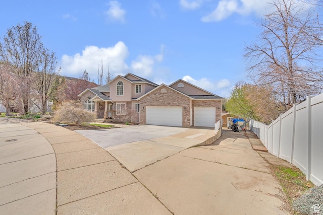 8079 S Juniper Ct, South Weber, UT 84405 - traditional-style home with concrete driveway, a garage, and fence