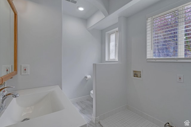 8079 S Juniper Ct, South Weber, UT 84405 - bathroom featuring baseboards, a sink, and toilet