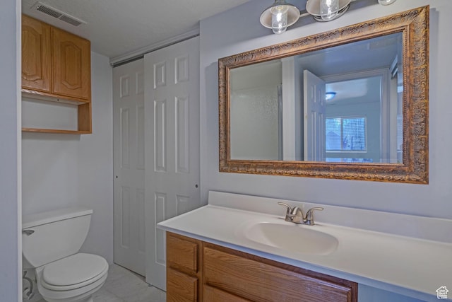 8079 S Juniper Ct, South Weber, UT 84405 - bathroom featuring visible vents, toilet, and vanity