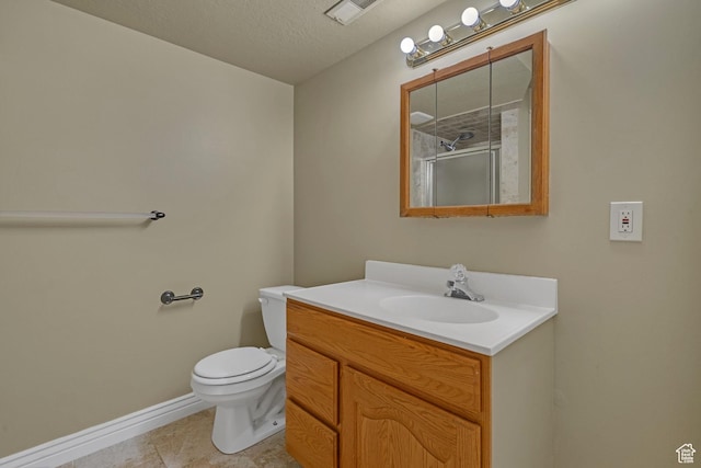 8079 S Juniper Ct, South Weber, UT 84405 - full bath featuring visible vents, baseboards, toilet, vanity, and a shower with door