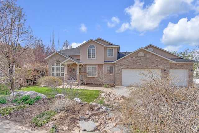 8079 S Juniper Ct, South Weber, UT 84405 - traditional home featuring driveway, a shingled roof, a garage, and stucco siding