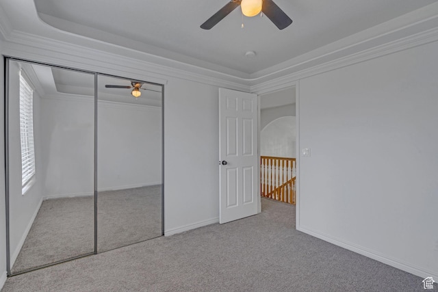 8079 S Juniper Ct, South Weber, UT 84405 - unfurnished bedroom with a closet, baseboards, a ceiling fan, crown molding, and carpet flooring