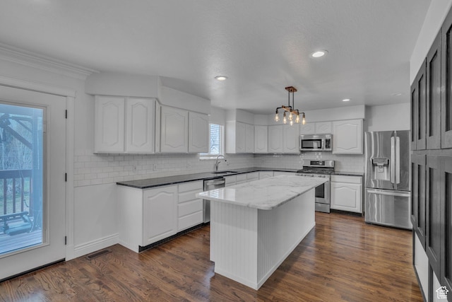 8079 S Juniper Ct, South Weber, UT 84405 - kitchen featuring white cabinetry, visible vents, appliances with stainless steel finishes, dark wood-style flooring, and a sink