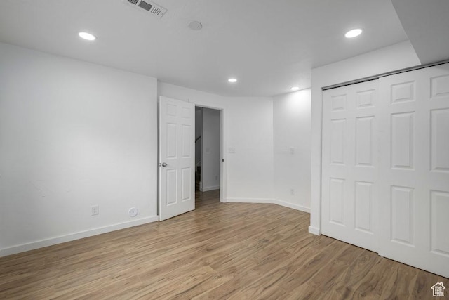 3833 W 1960 N, Lehi, UT 84043 - unfurnished bedroom with a closet, baseboards, recessed lighting, visible vents, and light wood finished floors