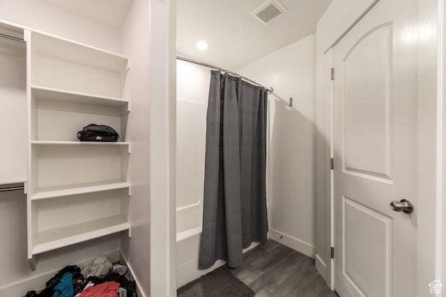 3833 W 1960 N, Lehi, UT 84043 - bathroom with visible vents, baseboards, shower / bath combo with shower curtain, and wood finished floors