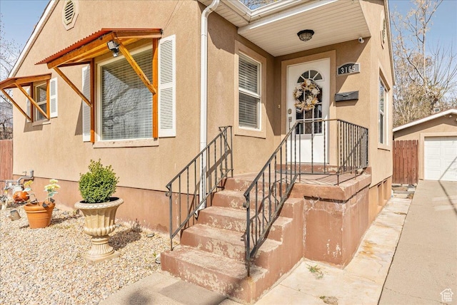 3165 S 2000 E, Millcreek, UT 84109 - property entrance featuring a detached garage and stucco siding