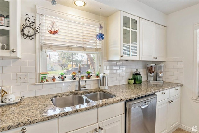 3165 S 2000 E, Millcreek, UT 84109 - kitchen featuring a sink, glass insert cabinets, stainless steel dishwasher, and white cabinetry