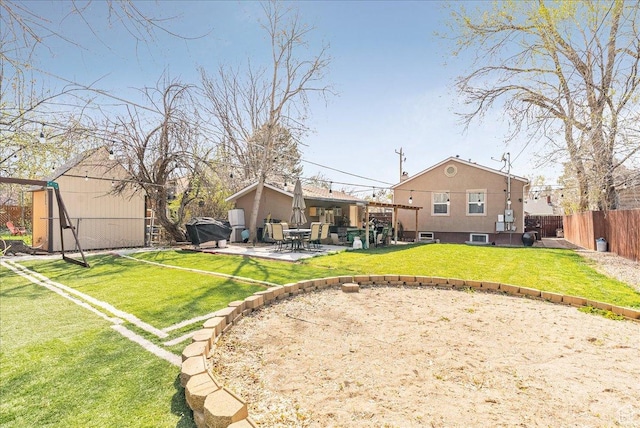 3165 S 2000 E, Millcreek, UT 84109 - view of yard with a patio, a fenced backyard, an outbuilding, and a storage unit
