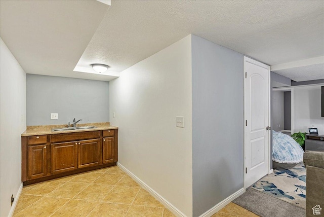 3165 S 2000 E, Millcreek, UT 84109 - interior space with a sink, light tile patterned floors, baseboards, and a textured ceiling