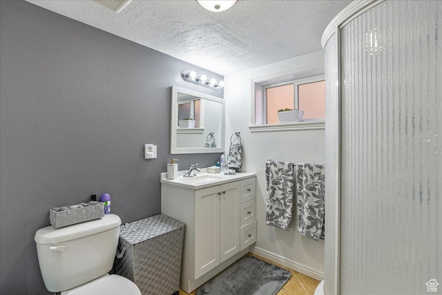 3165 S 2000 E, Millcreek, UT 84109 - bathroom with tile patterned flooring, toilet, vanity, and a textured ceiling