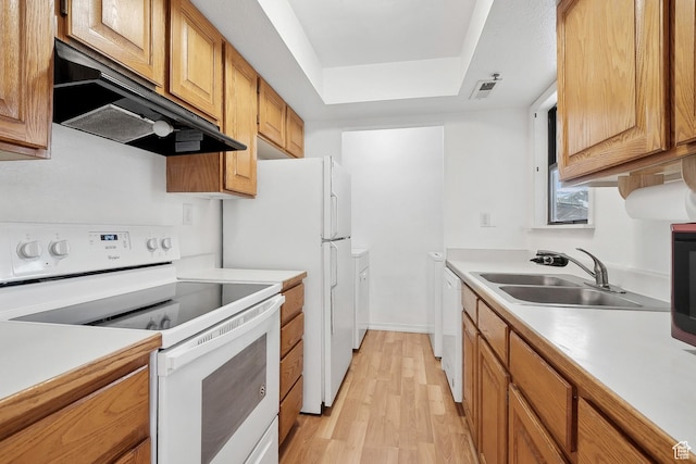 6831 N 2200 W Unit 12K, Park City, UT 84098 - kitchen with under cabinet range hood, white appliances, light countertops, and a sink