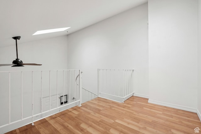 6831 N 2200 W Unit 12K, Park City, UT 84098 - spare room with light wood-style flooring, vaulted ceiling with skylight, ceiling fan, and baseboards