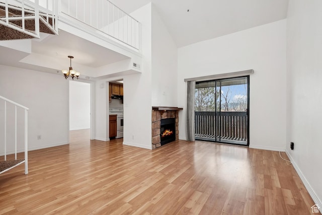 6831 N 2200 W Unit 12K, Park City, UT 84098 - unfurnished living room featuring light wood finished floors, baseboards, and a stone fireplace