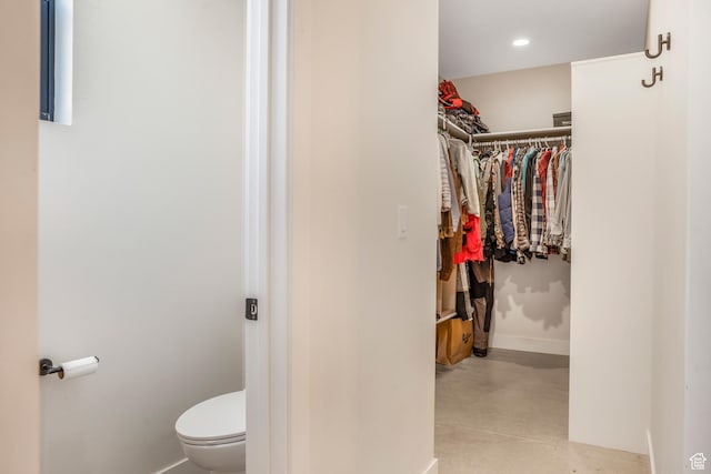 160 W Pebble, Rockville, UT 84763 - bathroom featuring toilet, a walk in closet, baseboards, concrete floors, and recessed lighting