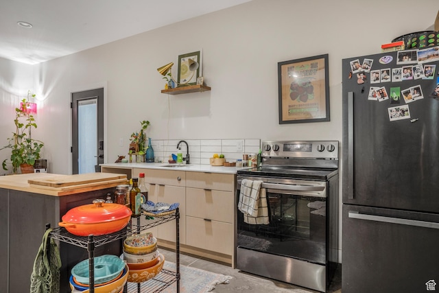 160 W Pebble, Rockville, UT 84763 - kitchen with appliances with stainless steel finishes, concrete flooring, a sink, open shelves, and decorative backsplash