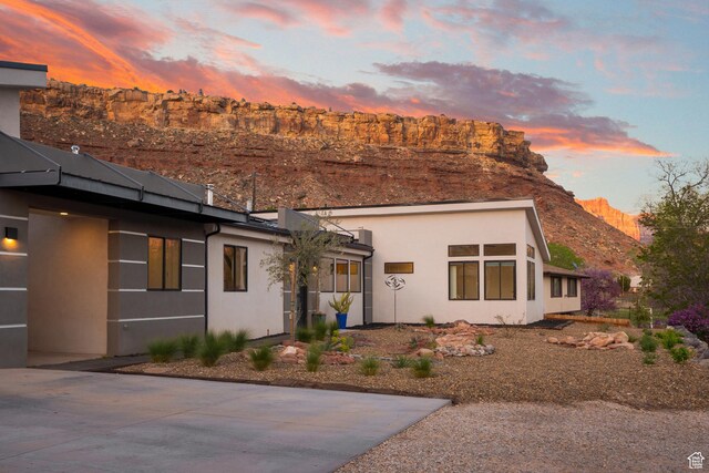 160 W Pebble, Rockville, UT 84763 - view of front facade with stucco siding and a mountain view