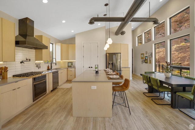 160 W Pebble, Rockville, UT 84763 - kitchen featuring stainless steel appliances, range hood, modern cabinets, a breakfast bar area, and light wood-style floors