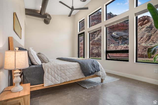 160 W Pebble, Rockville, UT 84763 - bedroom with finished concrete flooring, multiple windows, and baseboards
