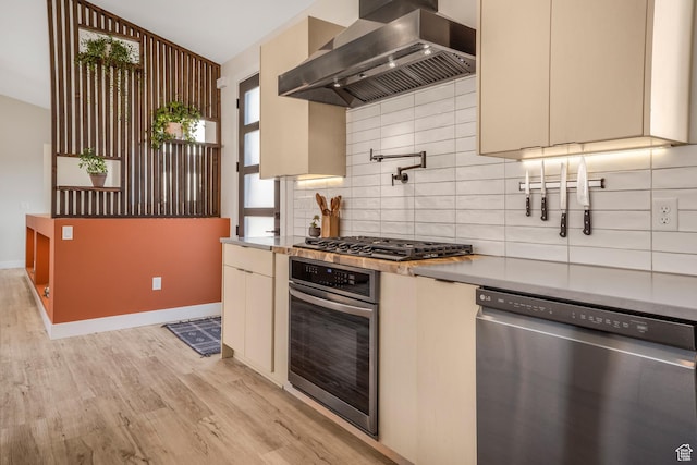 160 W Pebble, Rockville, UT 84763 - kitchen with stainless steel appliances, wall chimney range hood, light wood-type flooring, lofted ceiling, and decorative backsplash