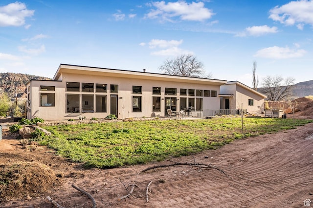 160 W Pebble, Rockville, UT 84763 - rear view of property featuring stucco siding, a mountain view, and a patio