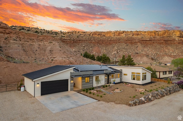 160 W Pebble, Rockville, UT 84763 - view of front of property with driveway, fence, stucco siding, and a standing seam roof