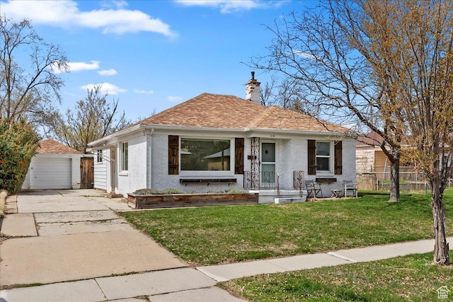 bungalow-style home featuring a front yard, a chimney, fence, an outdoor structure, and concrete driveway