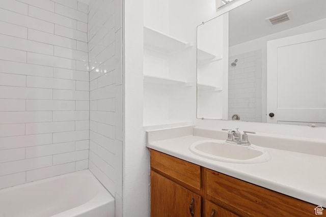 bathroom with  shower combination, vanity, and visible vents