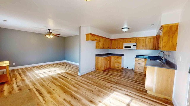 1653 N Cedar Blvd, Cedar City, UT 84721 - kitchen featuring white microwave, light wood-style flooring, a sink, and ceiling fan
