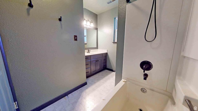 1653 N Cedar Blvd, Cedar City, UT 84721 - bathroom with baseboards, vanity, and shower / washtub combination