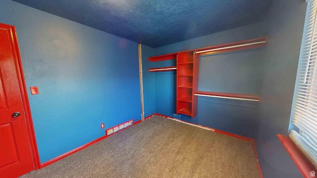 1653 N Cedar Blvd, Cedar City, UT 84721 - unfurnished bedroom featuring a closet, baseboards, carpet, and a textured ceiling