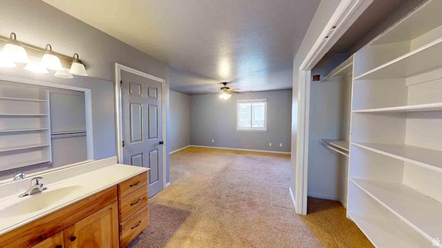 1653 N Cedar Blvd, Cedar City, UT 84721 - bathroom with baseboards, a ceiling fan, and vanity