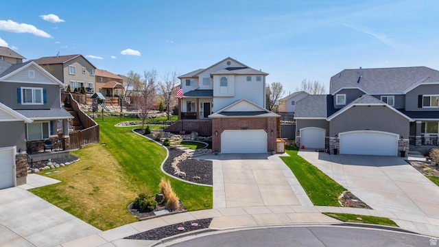 view of front of property with driveway, a residential view, and a front lawn