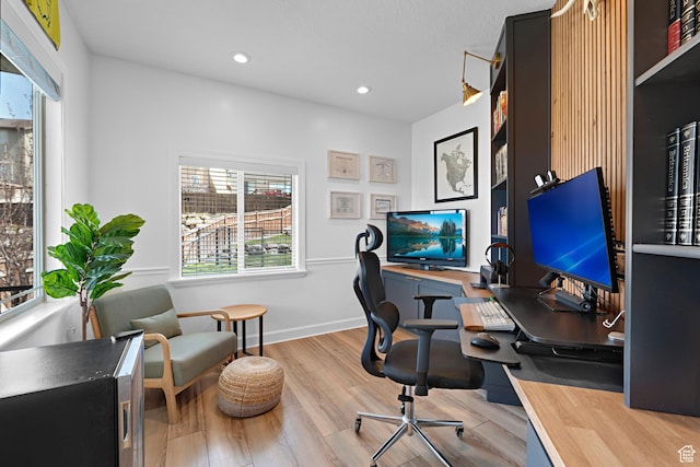 office area with recessed lighting, baseboards, and wood finished floors