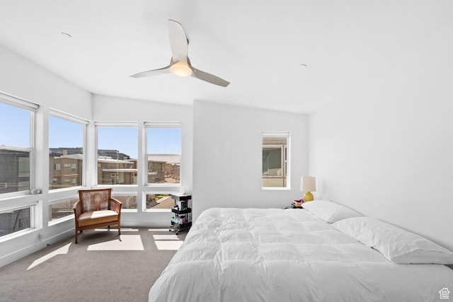 bedroom with ceiling fan and carpet floors