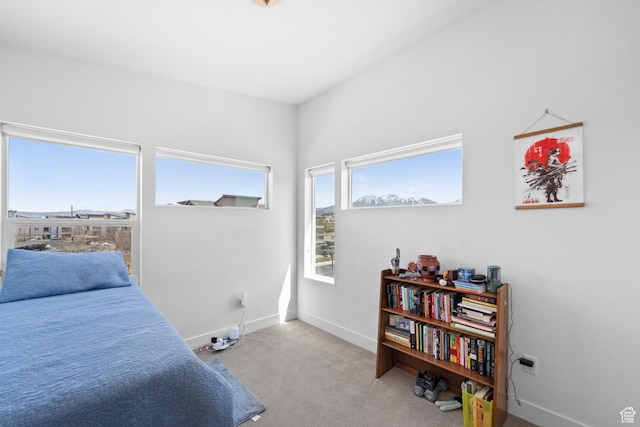 carpeted bedroom with baseboards