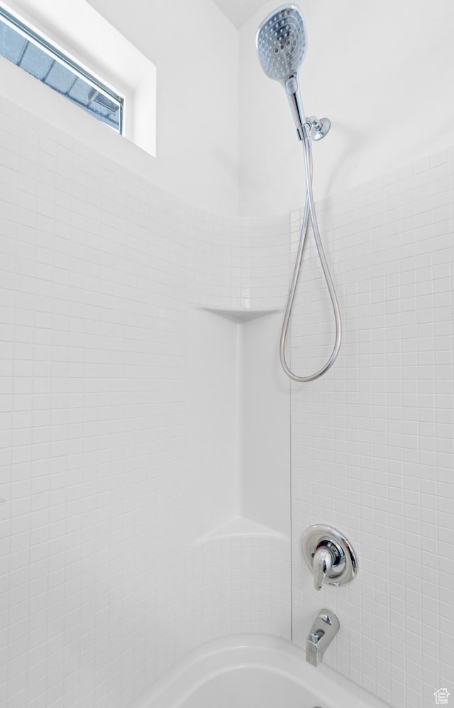 bathroom with shower / bath combination
