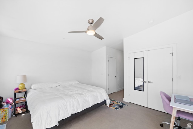 carpeted bedroom with a closet and a ceiling fan
