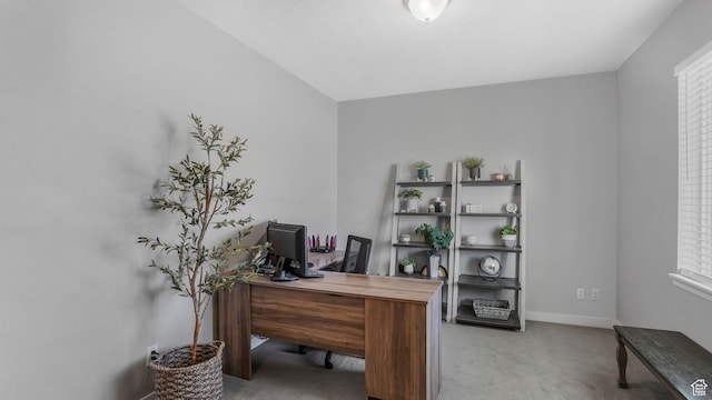 home office featuring carpet flooring and baseboards