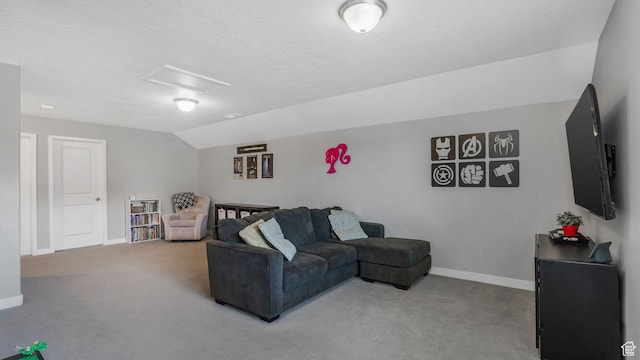 living area with attic access, baseboards, lofted ceiling, and carpet floors