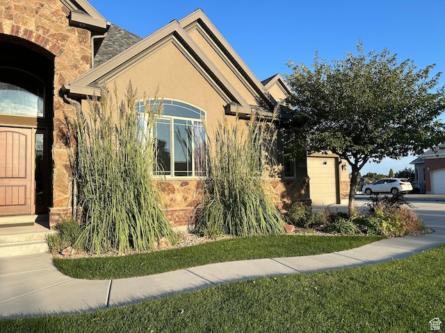 1234 S Parkway Blvd E Unit 725, Saratoga Springs, UT 84045 - view of home's exterior featuring stucco siding and stone siding